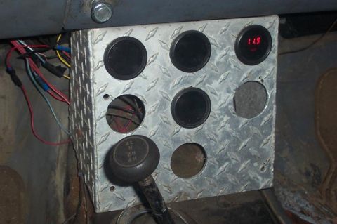 1979 Ford Bronco — Diamond plate gauge cluster with multiple gauges and a shifter knob