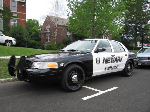 1991 Ford LTD Crown Victoria - Front three-quarter view of a black-and-white Newark Police Crown Victoria (unit 811) fitted with a front push bar.