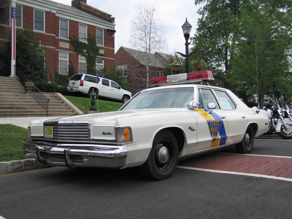 White NJ State Police Dodge Royal Monaco, front three-quarter with chrome grille and roof bar