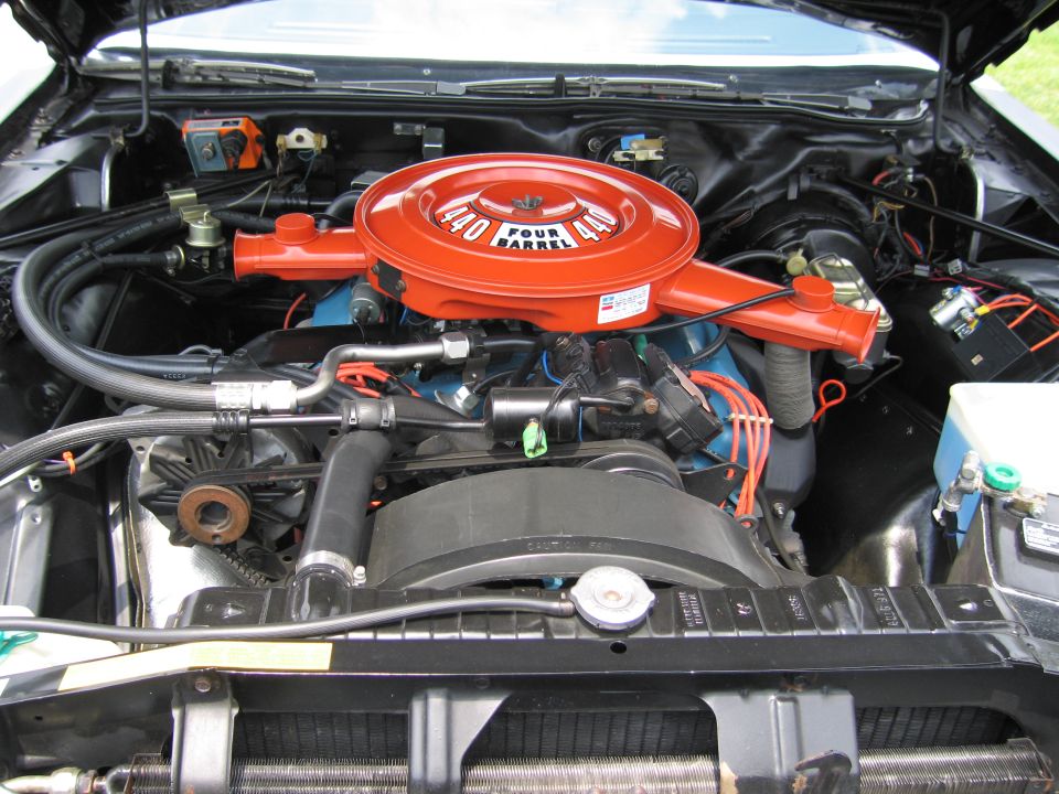 Engine compartment with orange 440 Four Barrel air cleaner and blue V8 block