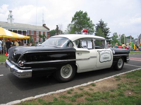 1991 Ford LTD Crown Victoria - Rear three-quarter of a black-and-white 1950s police sedan lettered Schraalenburgh Township.