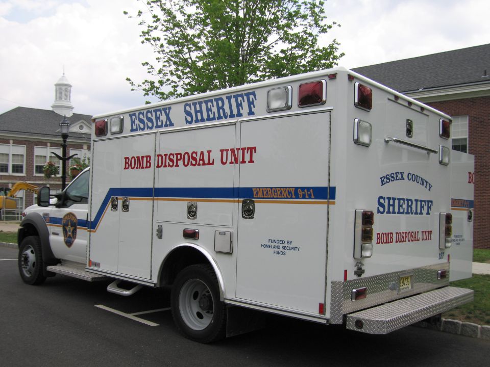 White Essex County Sheriff bomb disposal unit truck, rear three-quarter view