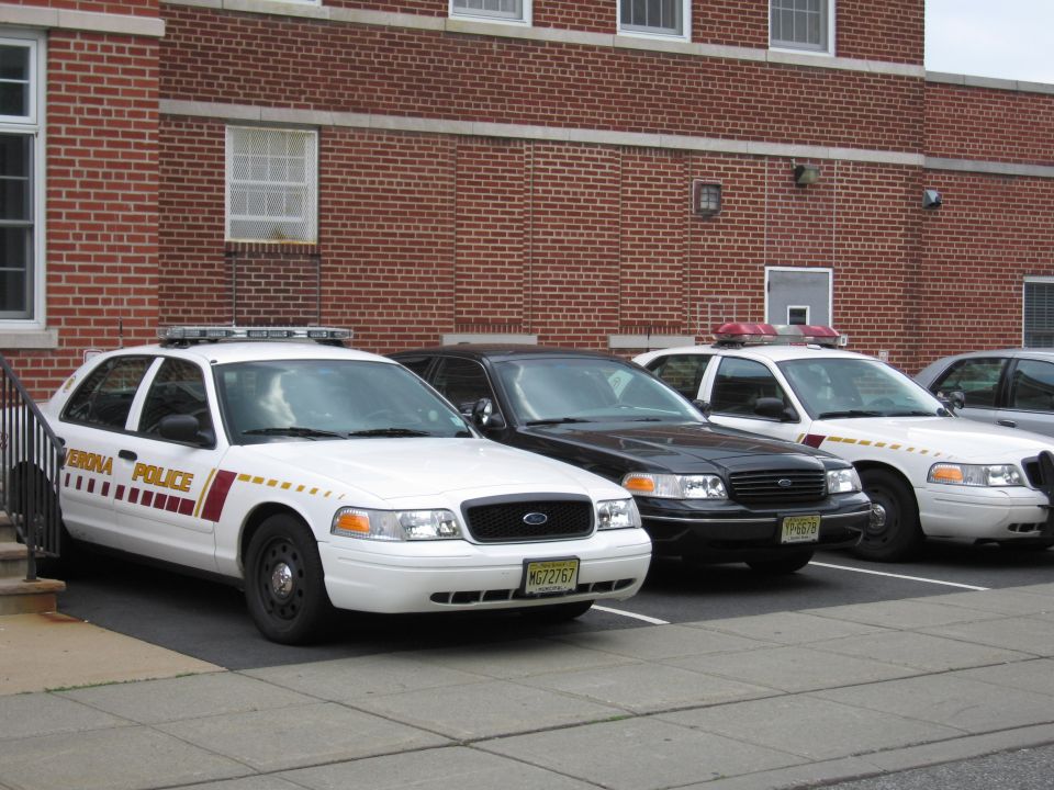 White Verona Police Ford Crown Victoria with light bar, front three-quarter view