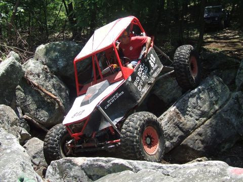 1967 Ford Bronco - A custom-built buggy navigates a rocky trail, with another vehicle visible in the background.