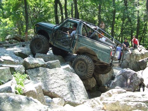 1967 Ford Bronco - This modified 1967 Ford Bronco navigates a challenging rocky terrain during an off-road excursion.