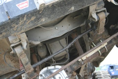 1990 Chevrolet Suburban - Undercarriage components including suspension and drivetrain parts are visible in this close-up.