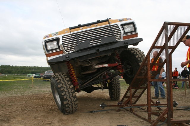 Ford F-Series truck on a ramp, front end up
