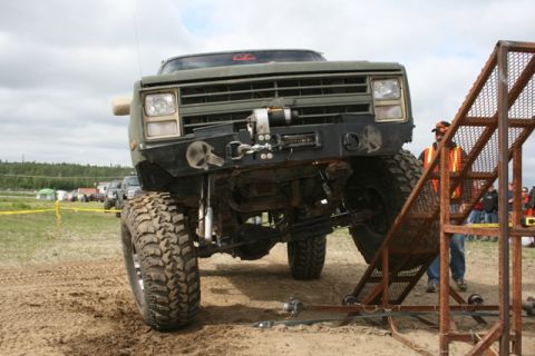 1990 Chevrolet Suburban - Modified 1988 Chevrolet K5 Blazer with off-road tires and winch, positioned near a ramp.