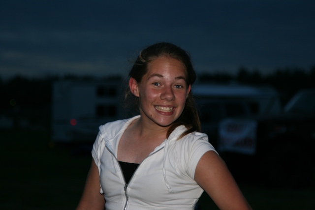 Young woman smiling at dusk