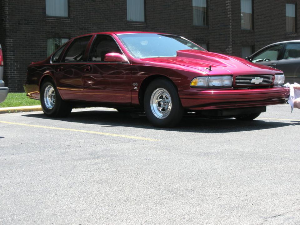 Dark red Chevrolet Caprice/Impala SS sedan parked in a lot