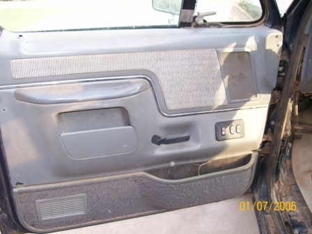 1988 Ford Bronco - The interior door panel shows a fabric insert and a storage pocket. A date stamp is visible in the lower right corner.
