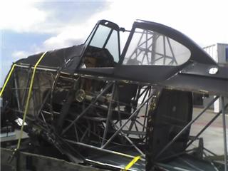 1992 Ford Bronco - An aircraft cockpit structure is secured to a trailer for transport.