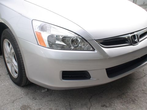 1993 Ford C-350 (Centurion Conversions) - Front end of a silver Honda Accord, likely from the 2003-2007 model range.