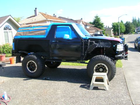 1996 Ford Bronco - This 1996 Ford Bronco is being prepped for paint, with its windows and trim taped off.