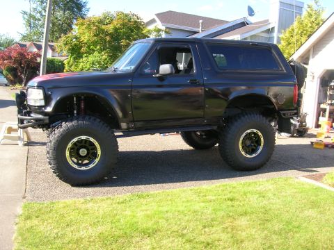 1996 Ford Bronco - This modified 1996 Ford Bronco features a significant lift kit and aggressive off-road tires.