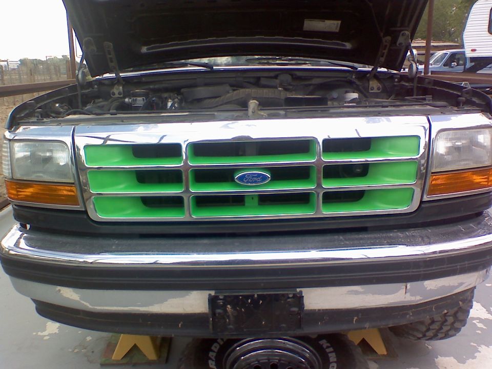 Green grille on 1993 Ford Bronco with hood open