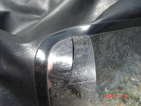1993 Ford Bronco - Detail of a damaged soft top seam, showing wear and condensation on the plastic window.