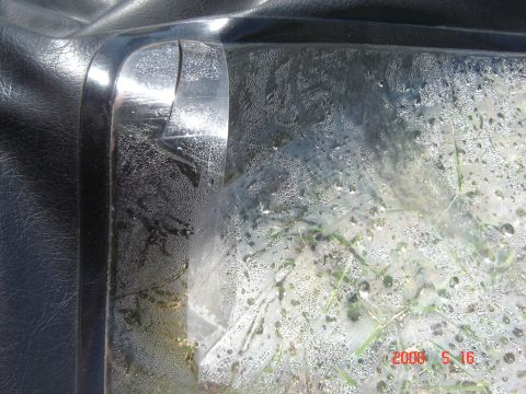 1993 Ford Bronco - Condensation has formed on the inside of the clear plastic window of a vehicle's soft top.