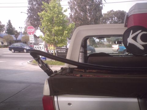 1991 Ford Bronco - Rear view of a 1991 Ford Bronco showing the bed, cooler, and a KC logo sticker.