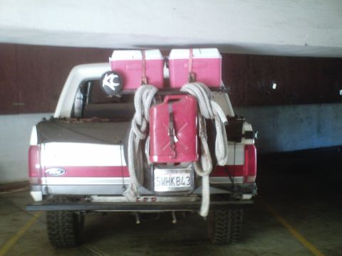 1991 Ford Bronco - Rear view of a 1991 Ford Bronco equipped for camping, a roof-mounted gas can and coolers.