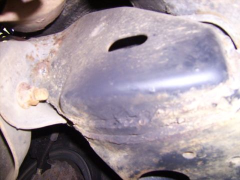 1982 Ford LTD Crown Victoria - Close-up view of a rusty undercarriage component with visible wear and tear.