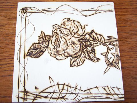 1995 Ford C-350 (Centurion Conversions) - A pyrography artwork depicts a rose with intricate detailing of petals, leaves, and thorns, framed by decorative lines.