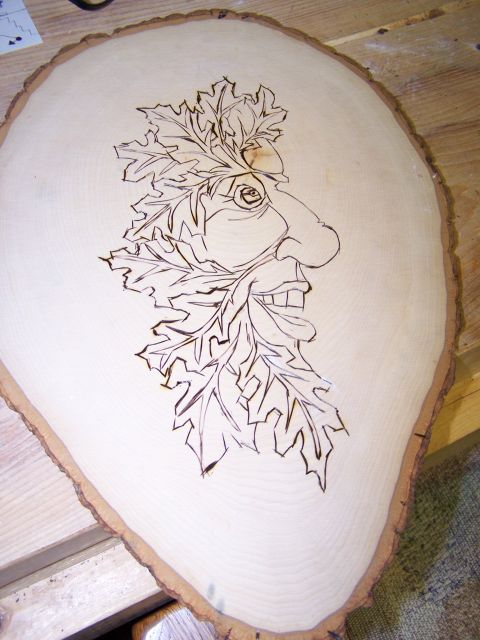 1995 Ford C-350 (Centurion Conversions) - A wood slice features pyrography art depicting a green man face with oak leaves. The registry entry for this item is incorrect.
