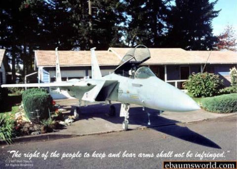 1980 Ford Bronco - A fighter jet is parked in a residential area, with its canopy open, casting a long shadow.