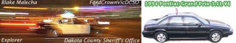1972 Pontiac Grand Prix - Police car with flashing lights captured in motion, showing light streaks.