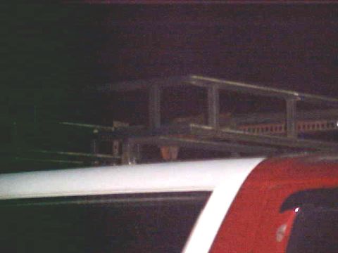 1987 Ford Bronco - The image shows a roof rack mounted on a vehicle, with part of the vehicle's body visible.