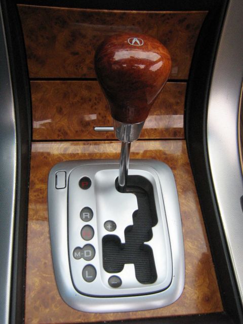 2004 Acura TL - Automatic gear shifter with wood trim and Acura logo.
