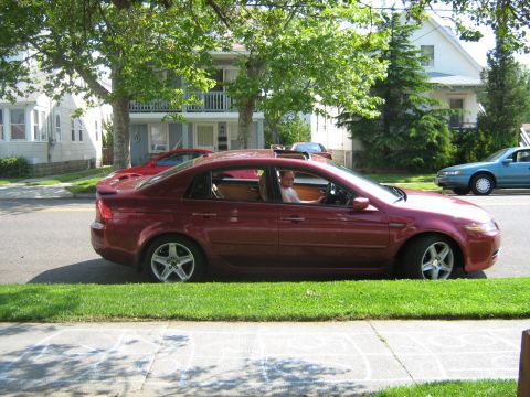 2004 Acura TL - A maroon 2004 Acura TL sedan is parked on the side of a residential street.