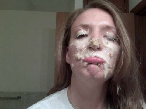 1995 Ford Bronco - A woman's face is covered in what appears to be food and sauce, with her eyes closed and lips sticking out.