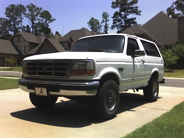 White 1996 Ford Bronco parked in driveway