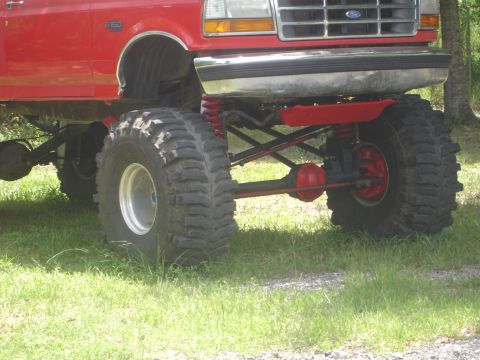 1989 Ford Bronco - This lifted 1989 Ford Bronco features oversized tires and a prominent suspension system, its off-road capabilities.