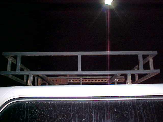 Custom roof rack mounted on white vehicle