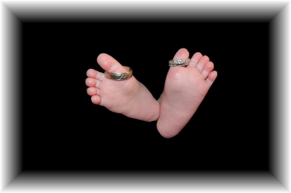 Baby feet with rings on toes