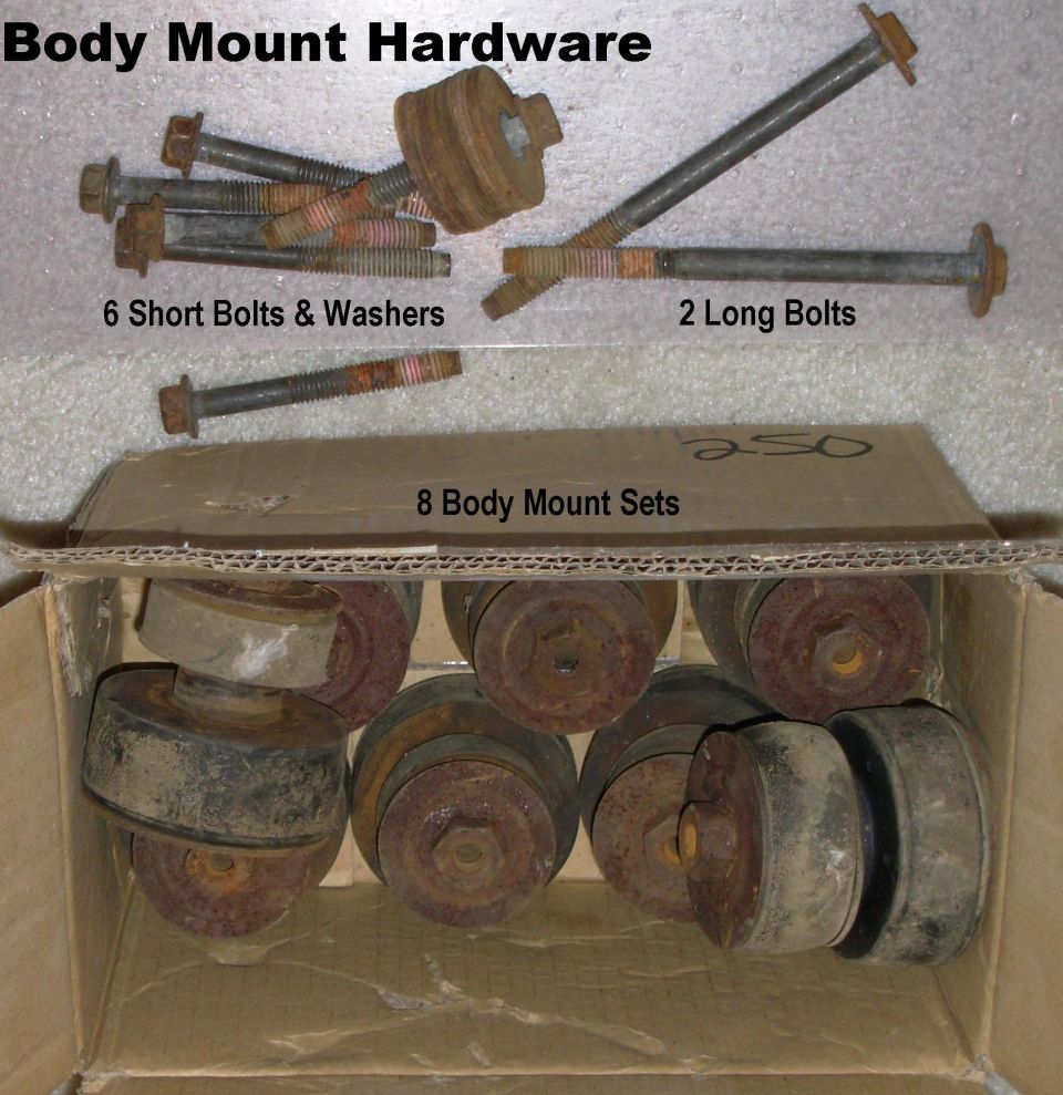 Box of rusty truck body mount bushings and bolts with labels