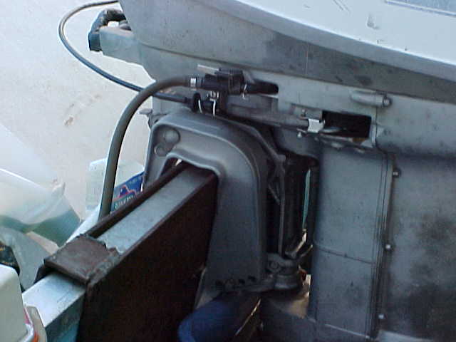 close-up of outboard motor mount and cables