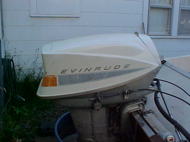 White Evinrude outboard motor with silver stripe