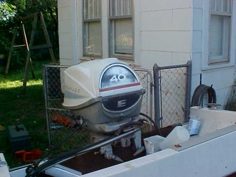 1987 Ford Bronco - Outboard boat motor with '40' on the cowl, mounted on a boat.