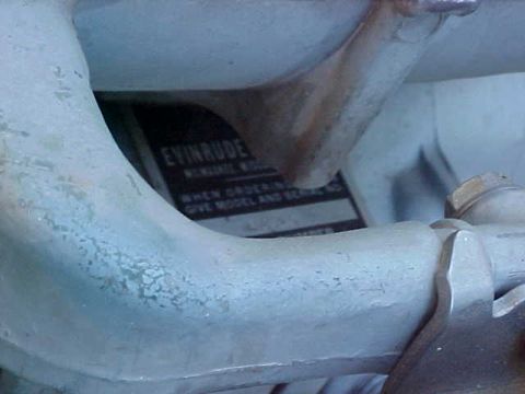 1987 Ford Bronco - Evinrude outboard motor data plate visible on engine component.