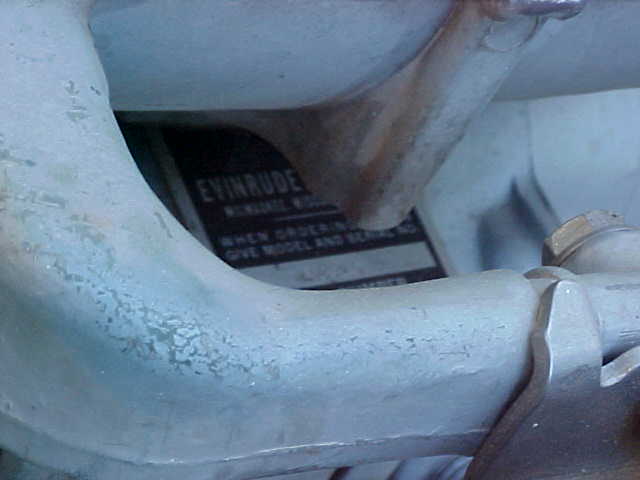 Close-up of an Evinrude outboard motor with a data plate