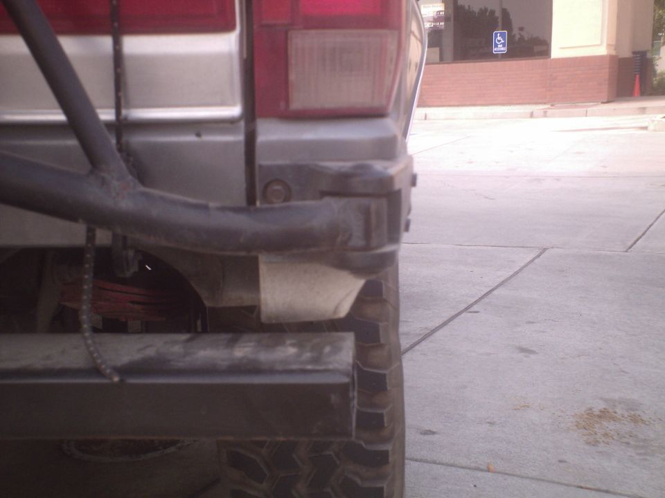 Rear bumper and tire of a 1991 Ford Bronco, showing a spare tire mount and leaf springs