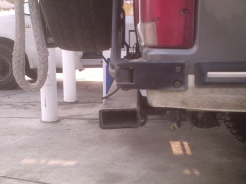1991 Ford Bronco - Rear view of a 1991 Ford Bronco, showing the bumper, spare tire mount, and taillight.