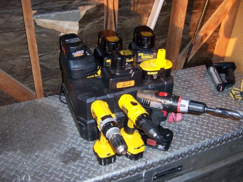 1991 Ford Bronco - Photograph of cordless power drills and battery chargers sitting on a metal toolbox.