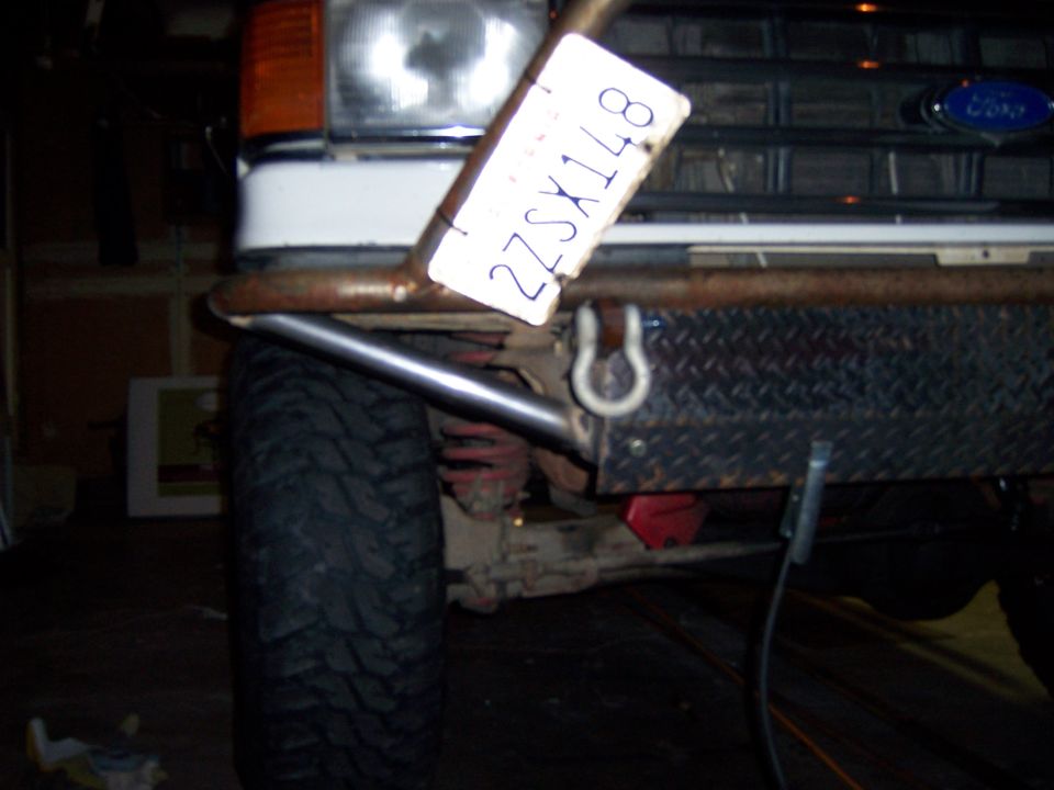 White Ford Bronco with custom metal bumper and license plate 22SX148