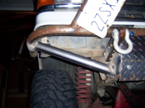 1991 Ford Bronco - Close-up view of a custom fabricated front bumper with a shackle mount and diamond plate accent.