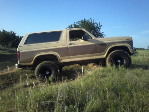 1986 Ford Bronco - 1986 Ford Bronco seen off-road on a sunny day with blue sky.