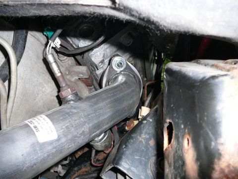 1997 Mercury Grand Marquis - Close-up view of an exhaust pipe and oxygen sensor, part of a vehicle's exhaust system.